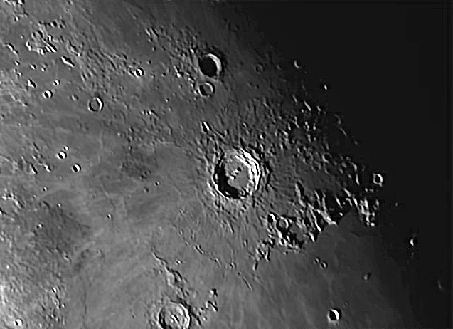 Moon 2018 Mar 26 Copernicus  area. "As I said to you, the atmospheric conditions deteriorated badly after taking a few images of the Moon with my DSLR on the 26th March.  I hadn't really tried to process the AVI files I took as they were shimmering badly but I had a go tonight.  Registax reduced my 1500 images to less that 300 because of poor quality but I have a couple of recognisable images of the Copernicus and Plato areas.  Not great, but better than I thought would come out of these AVI files.  I must get a better camera for lunar work as the Phillips Toucam has severe limitations,"